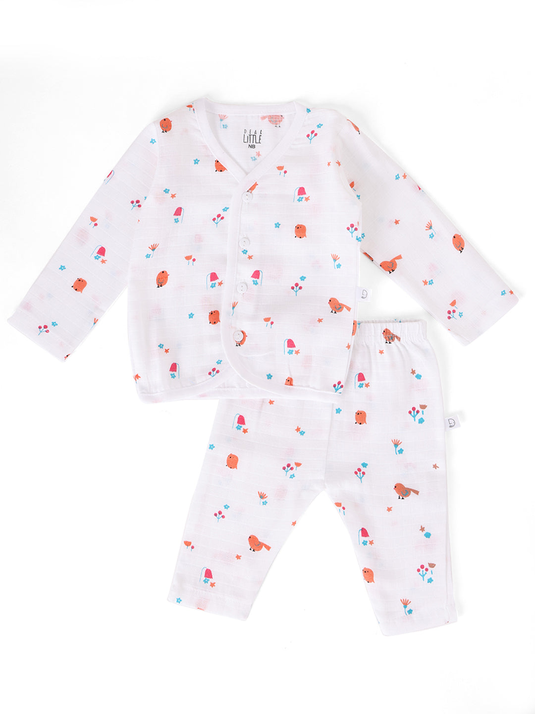 A white muslin baby outfit with a floral and animal pattern, consisting of a long-sleeve top and pants.