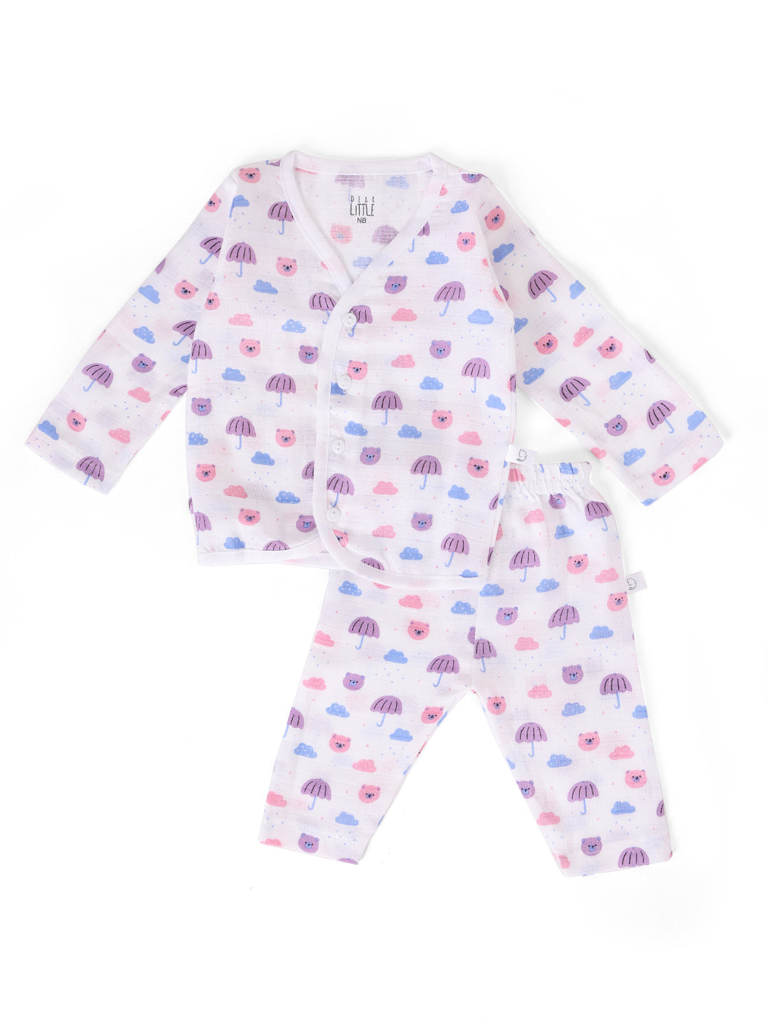 A baby wearing a pink and blue muslin full sleeve jhabla and pant set with cloud patterns.
