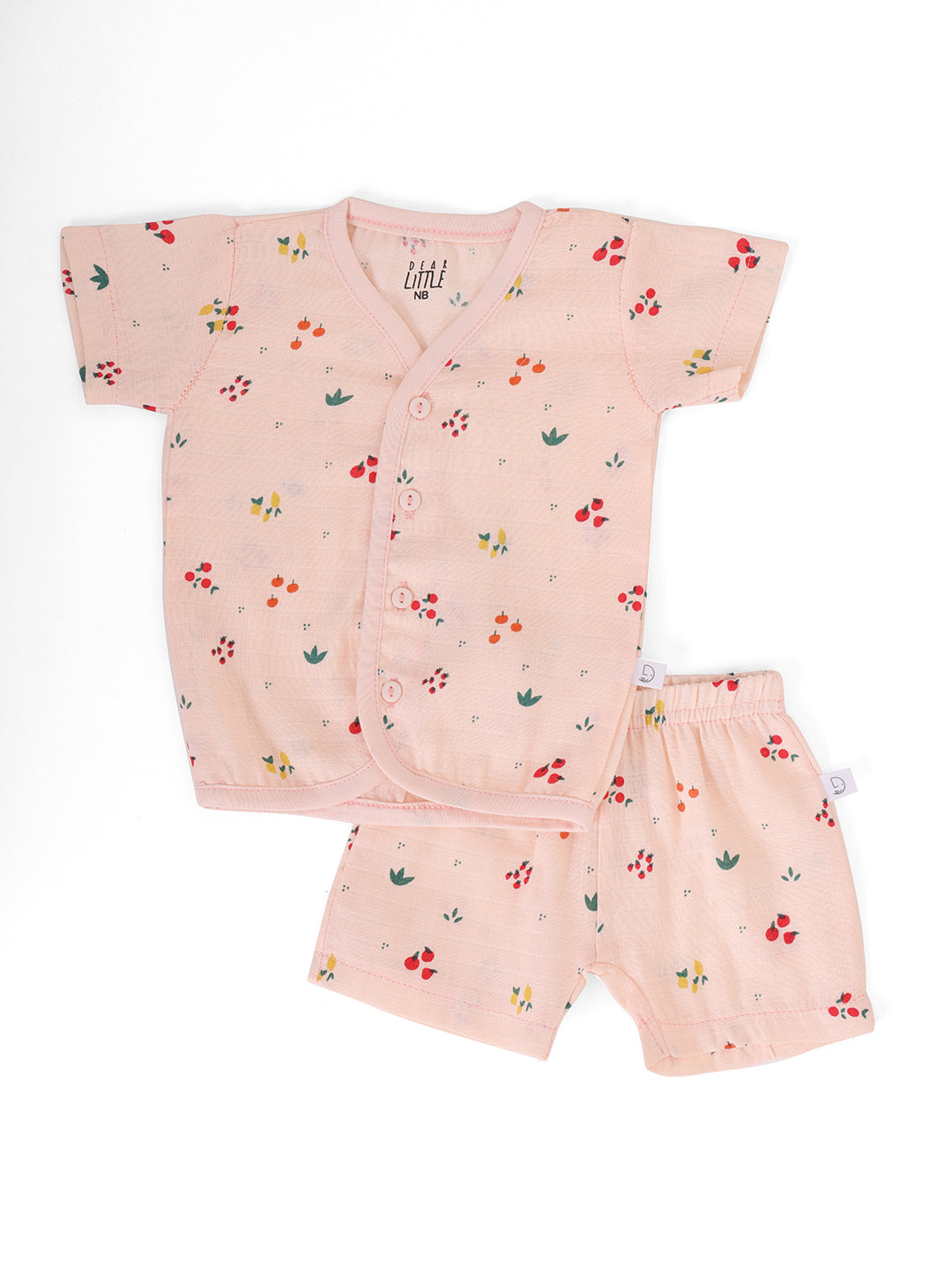 A peach-colored muslin half sleeve jhabla and shorts set for babies.