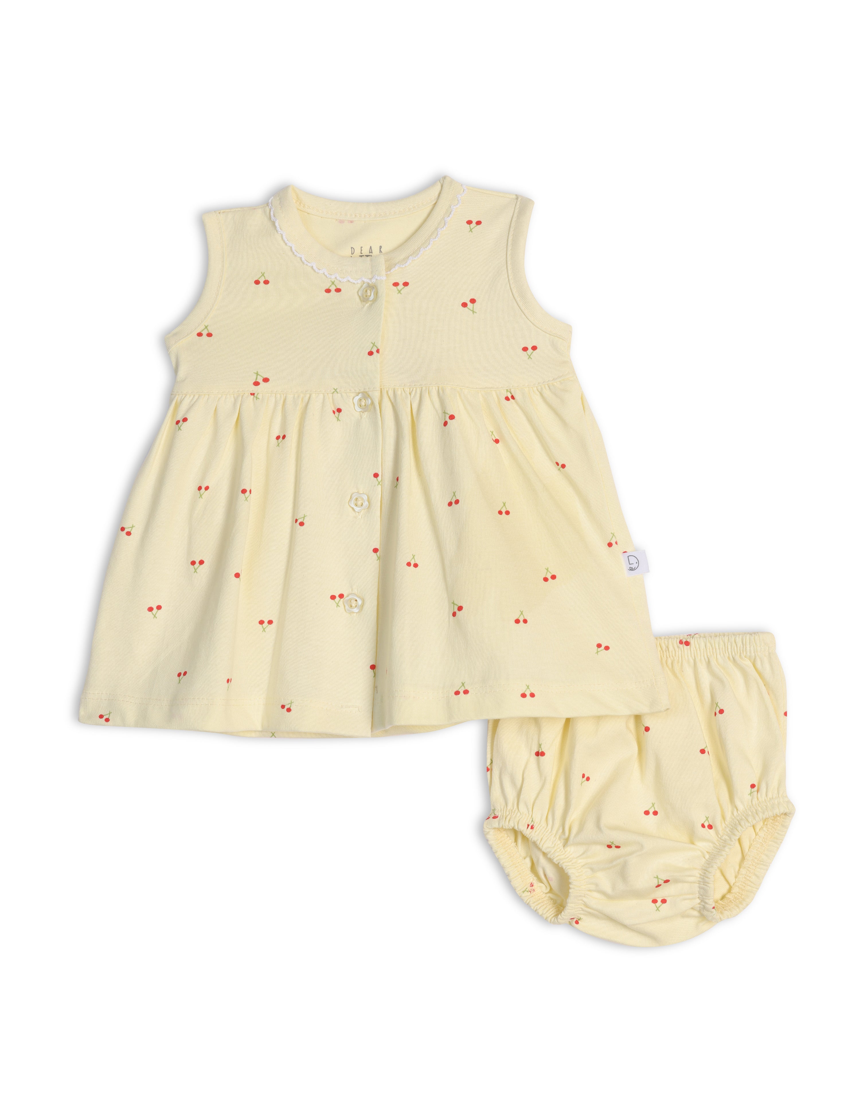 A sleeveless yellow cotton frock with cherry blossom print, accompanied by a matching bloomer.
