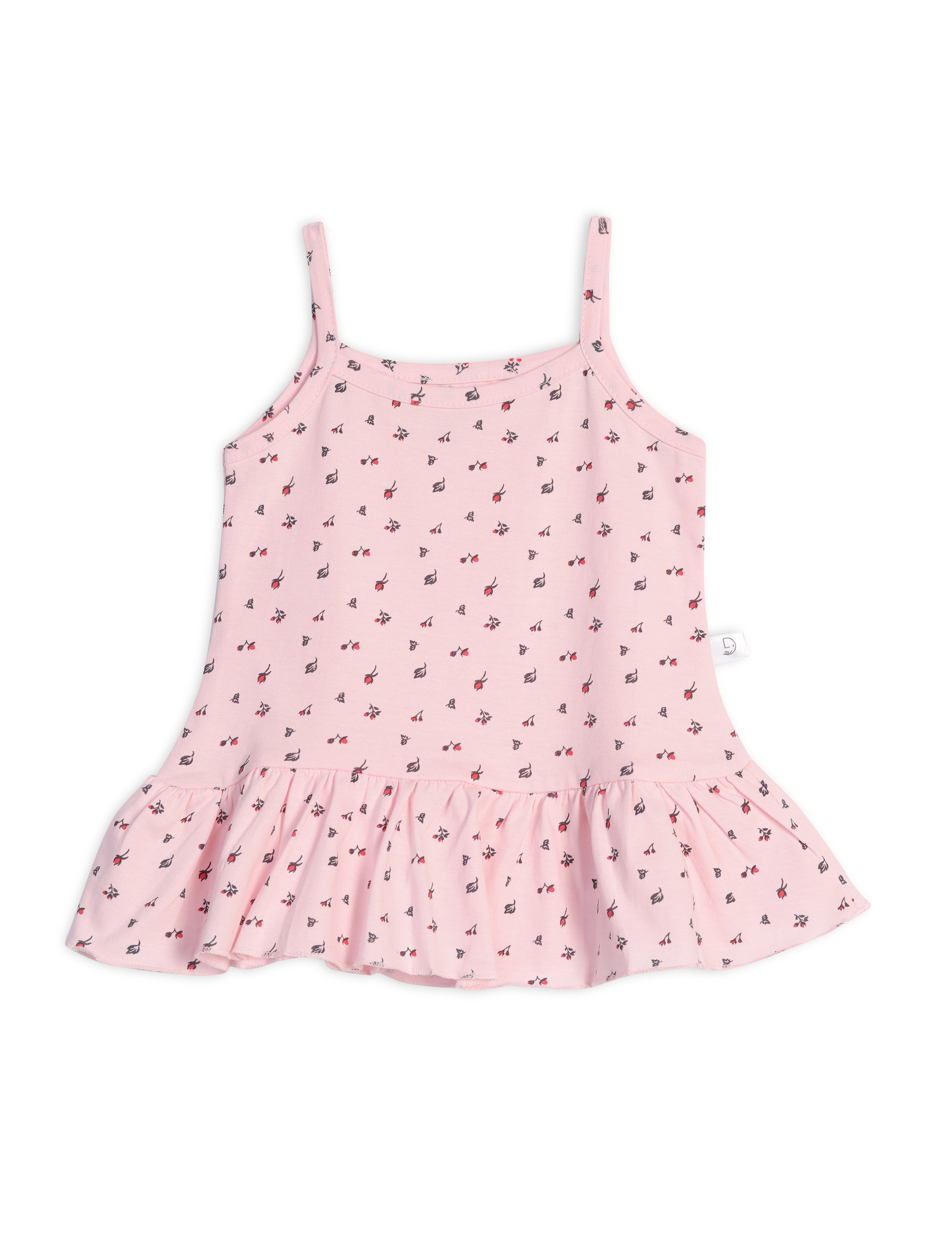 A pastel pink sleeveless frock with a floral pattern and frill detailing at the hem.