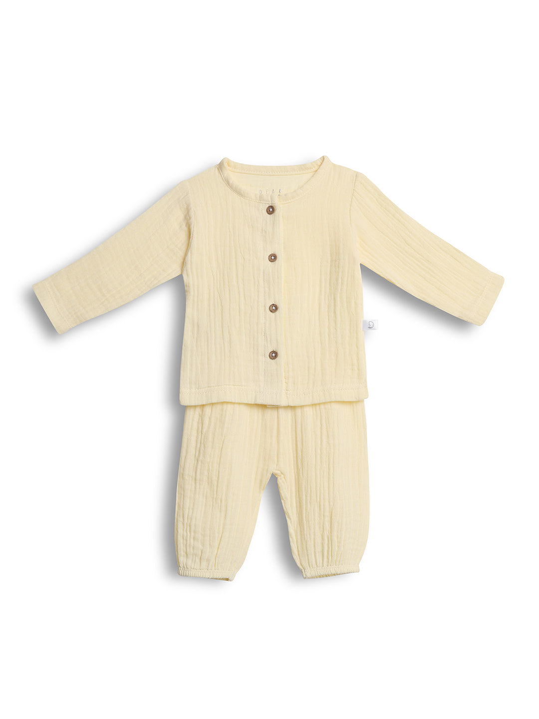 Cream-colored baby outfit with long-sleeve top and pants on a white background