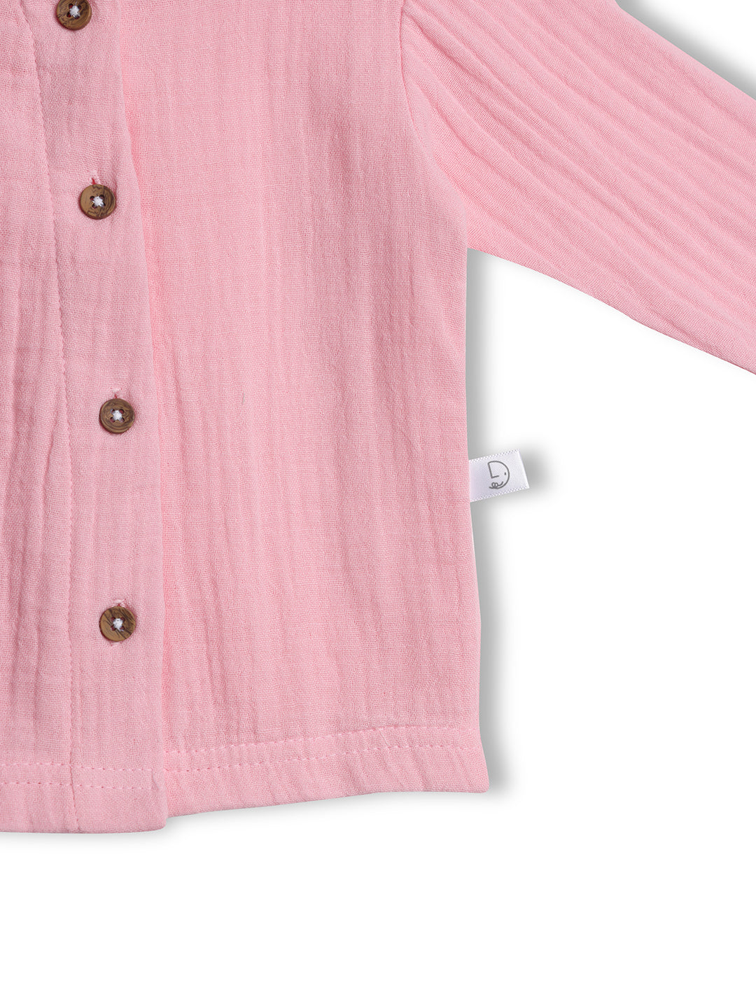 Close-up of a pink textured shirt with buttons on a white background