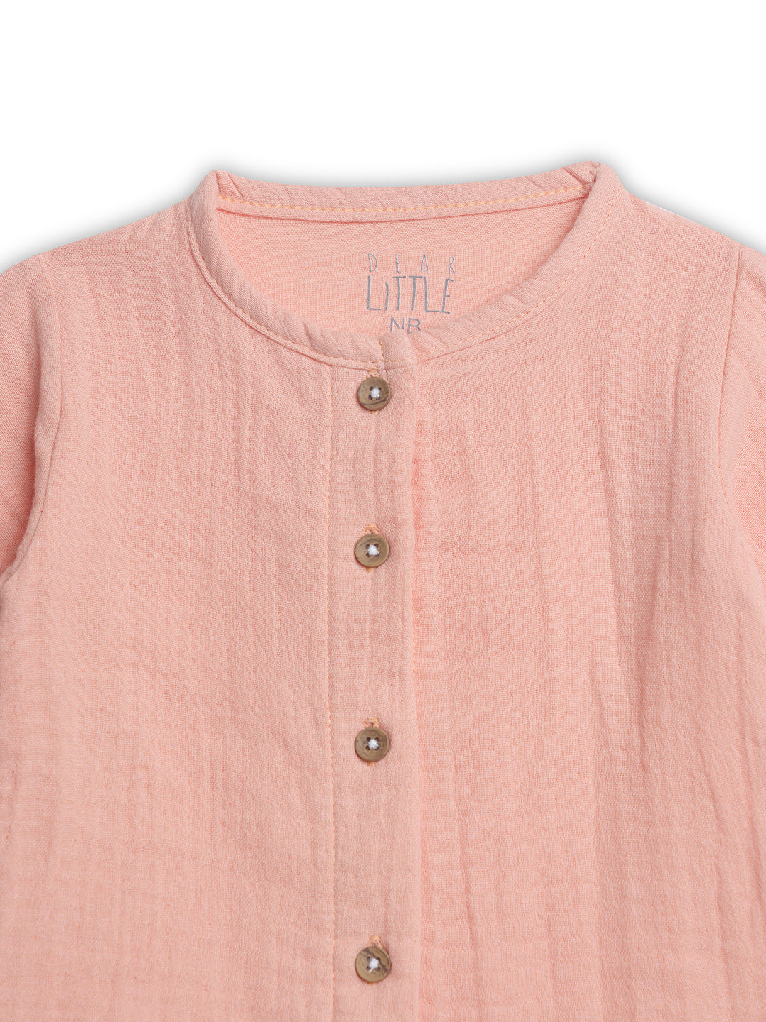 Pink sleeveless top with button details on a white background