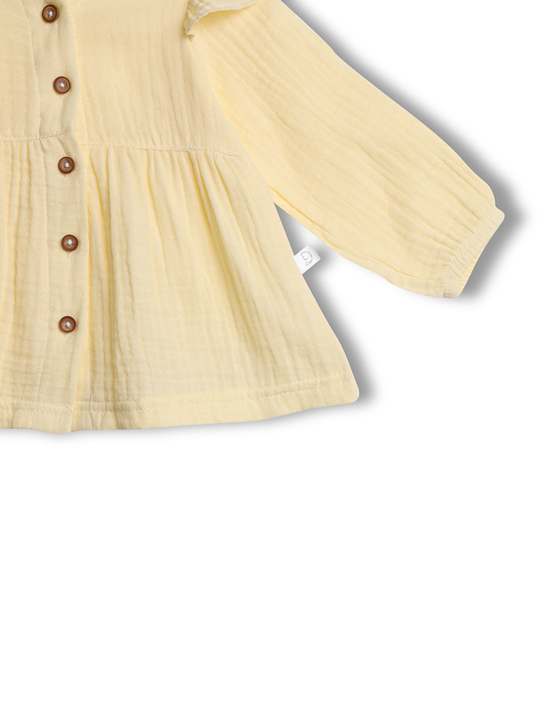Yellow dress with brown buttons on a white background