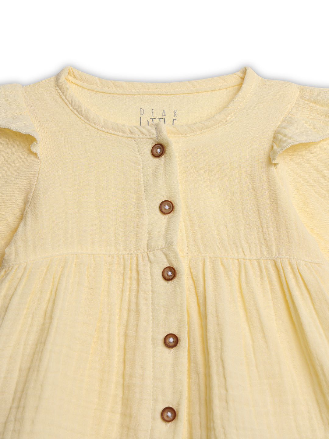 Yellow dress with buttons on a white background