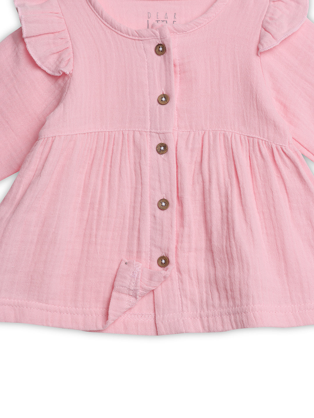 Pink dress with ruffled sleeves and buttons on a white background