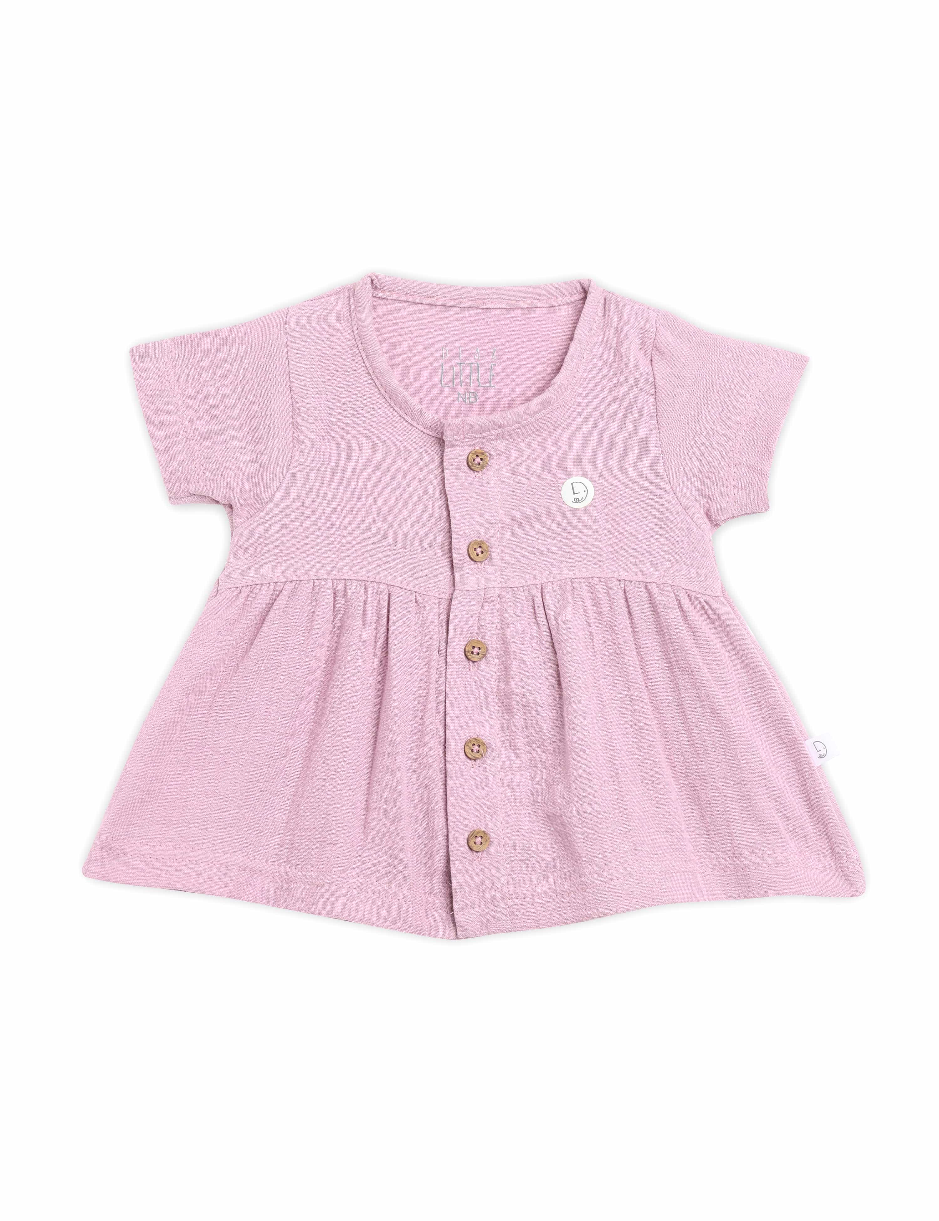 Pink baby dress with buttons on a white background