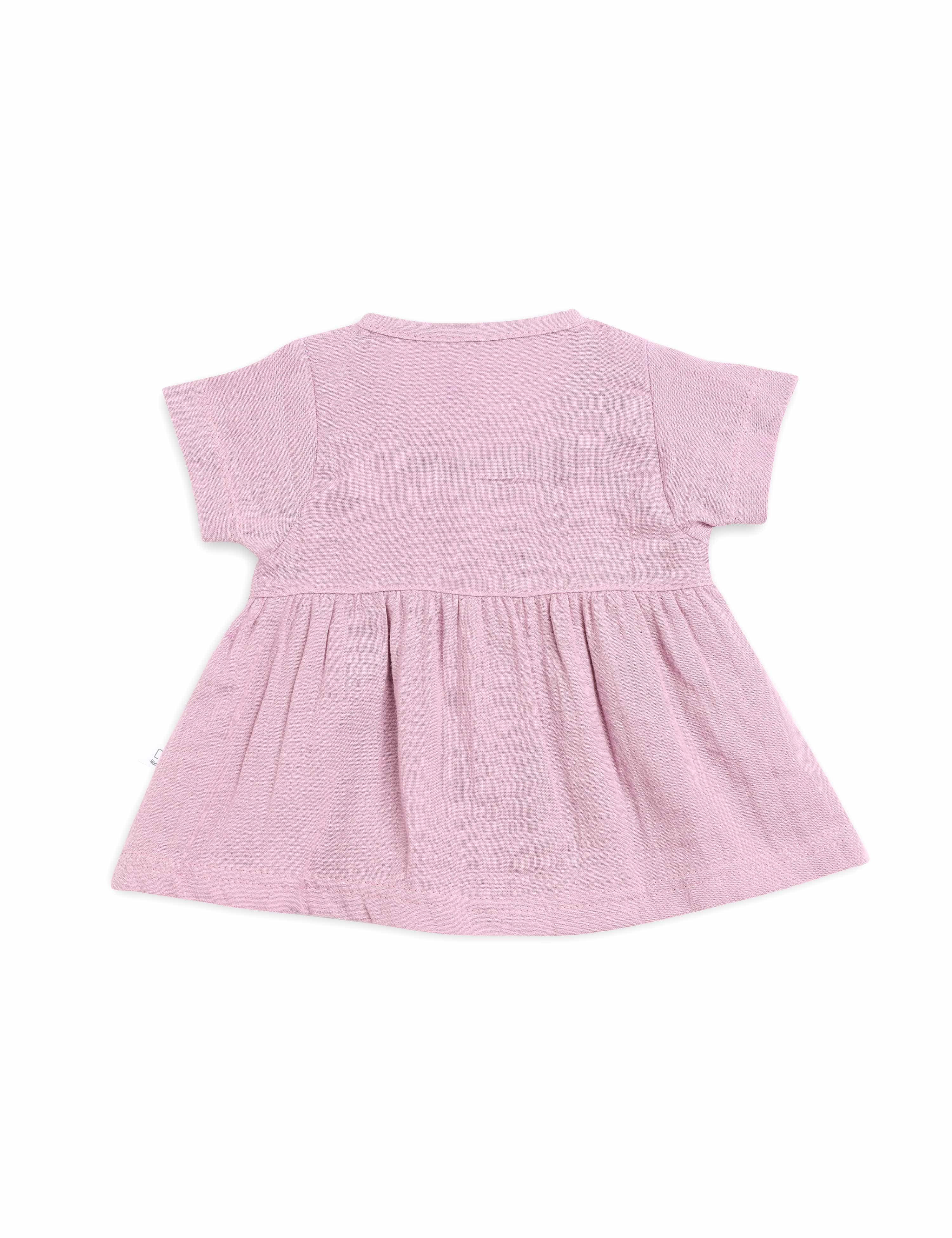 Pink baby dress on a white background