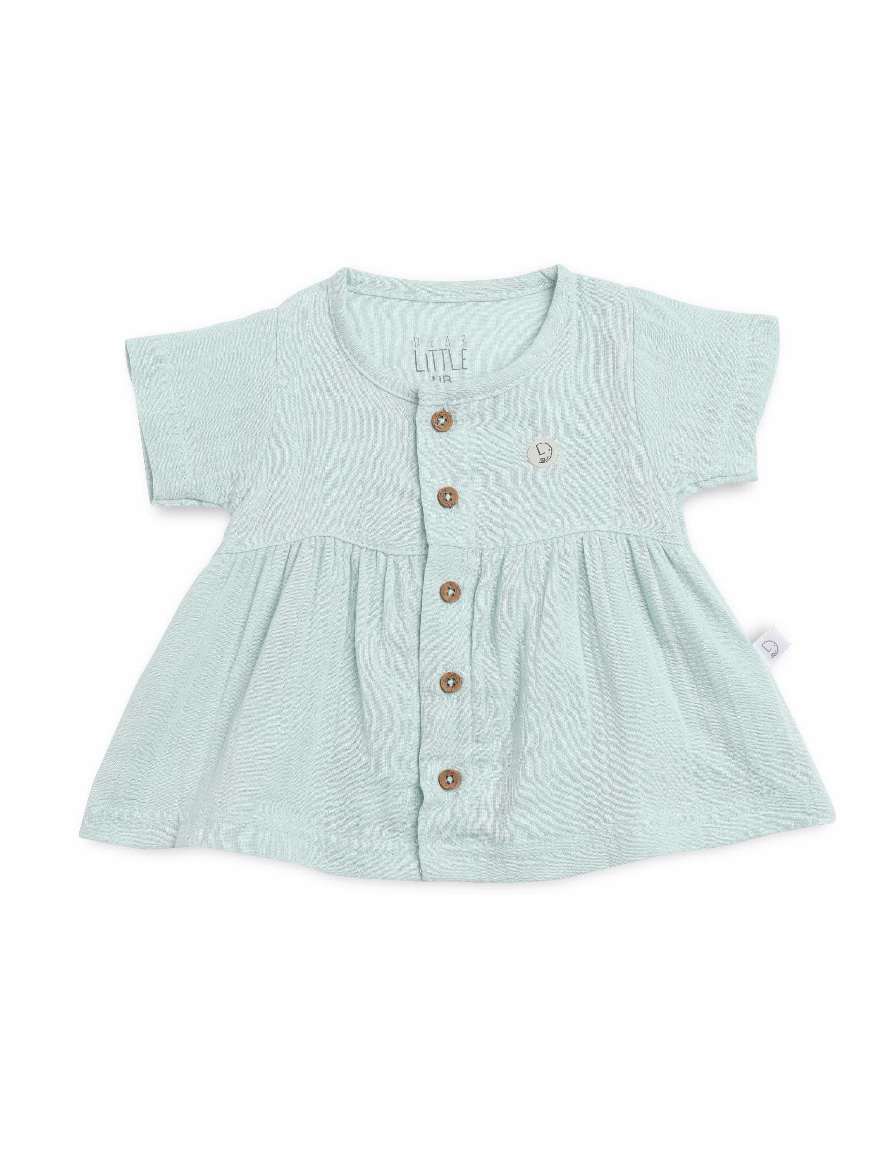 Light blue baby dress with buttons on a white background