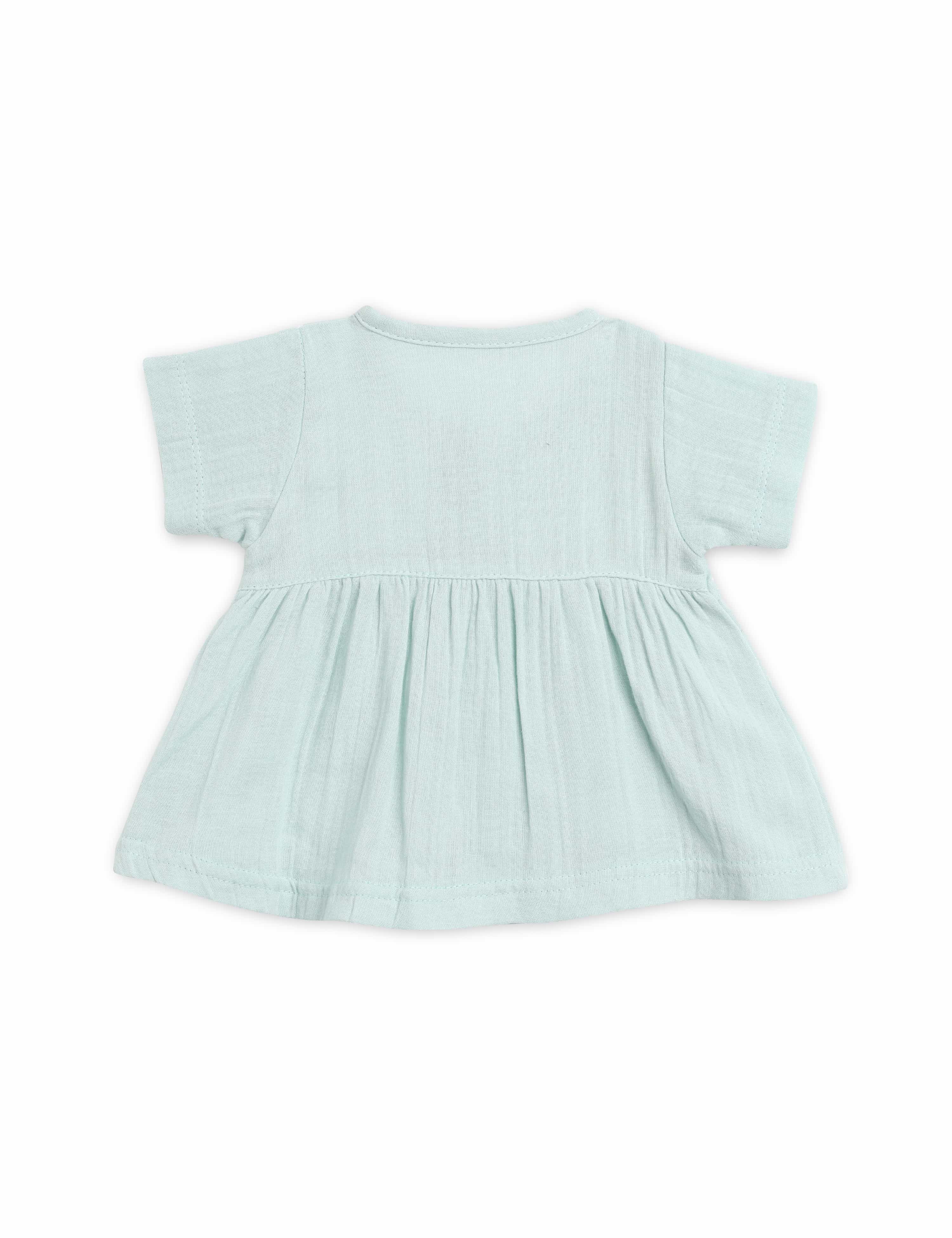 Light blue baby dress on a white background