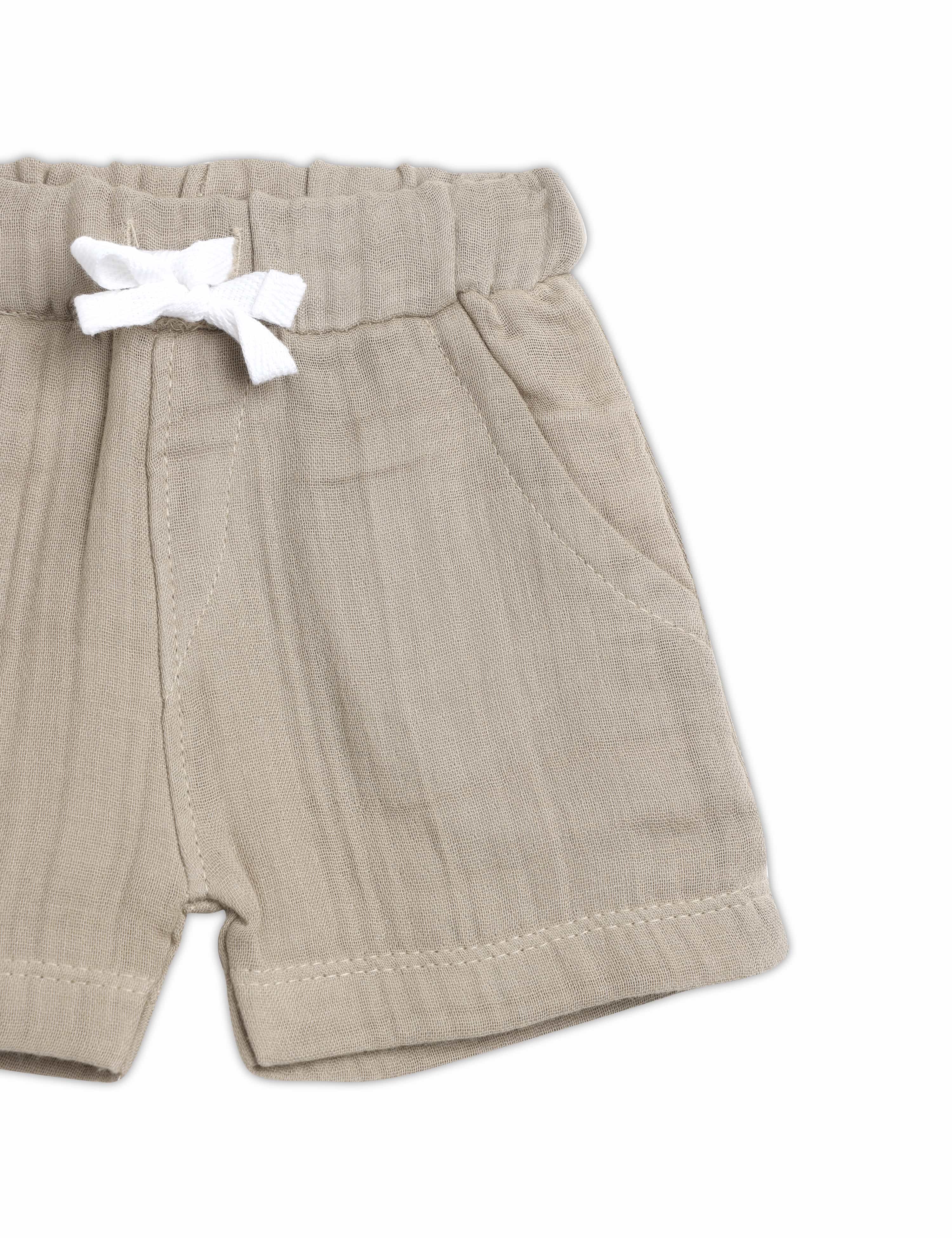 Beige shorts with a white bow on a white background