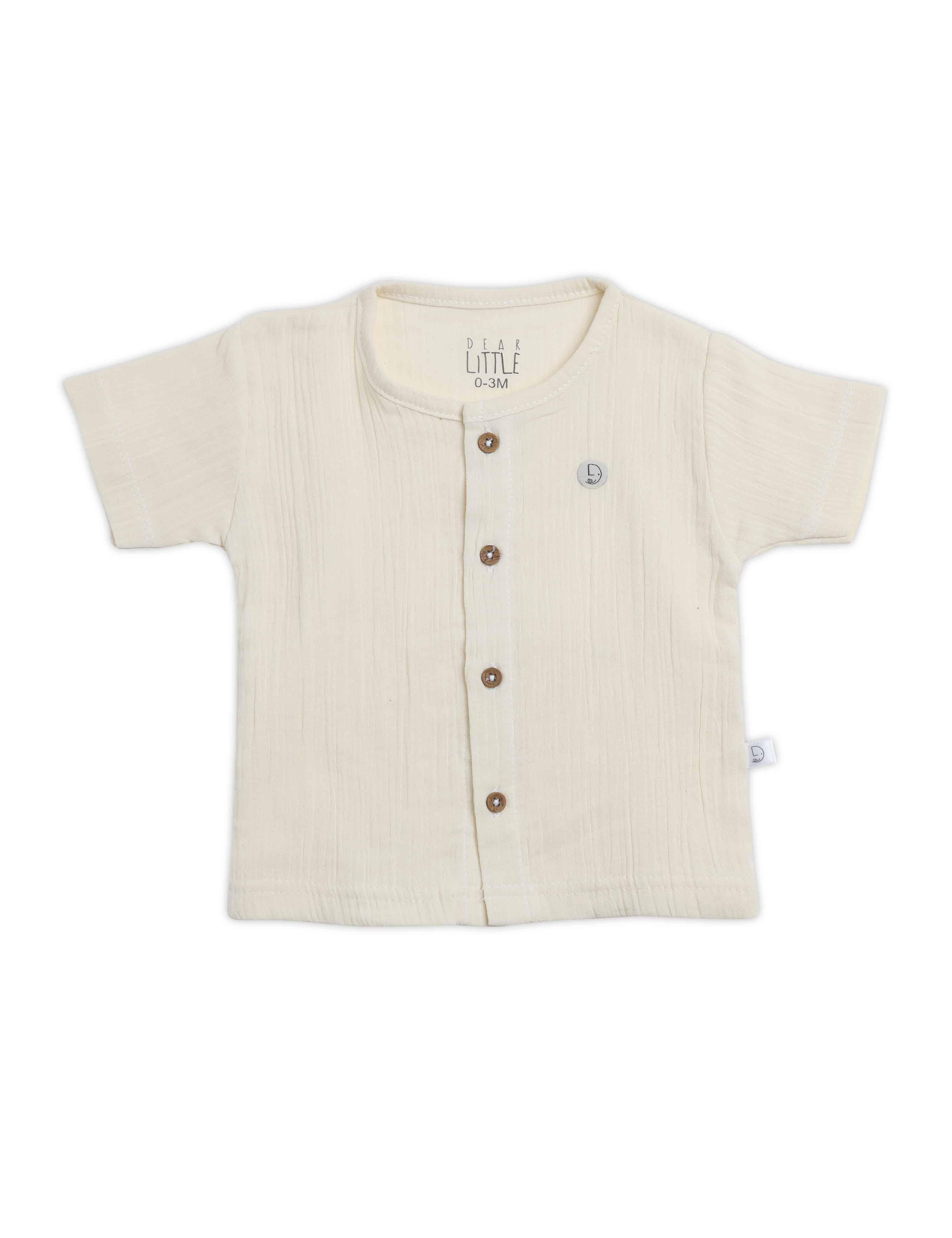 Beige baby shirt with buttons on a white background