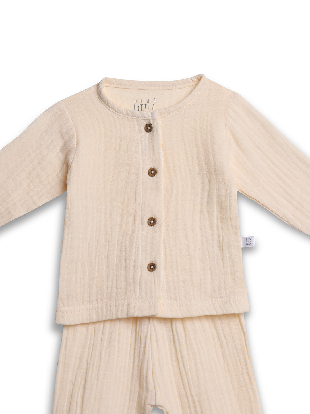 Beige baby outfit with long-sleeve top and pants on a white background