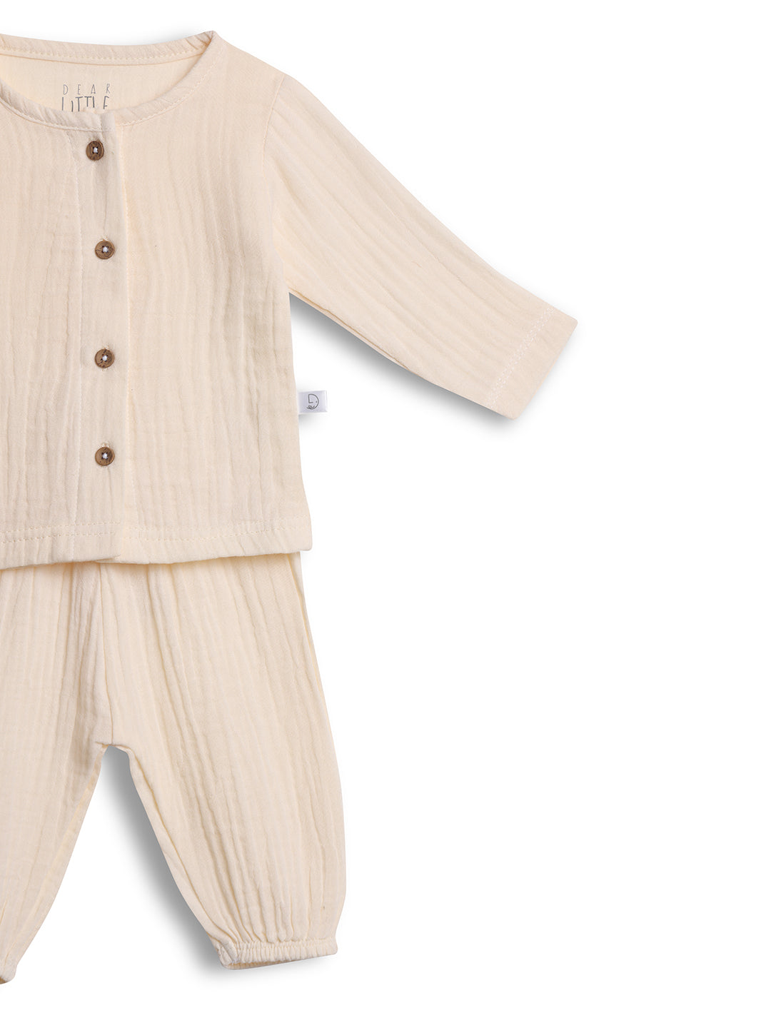 Beige baby outfit with a shirt and pants on a white background