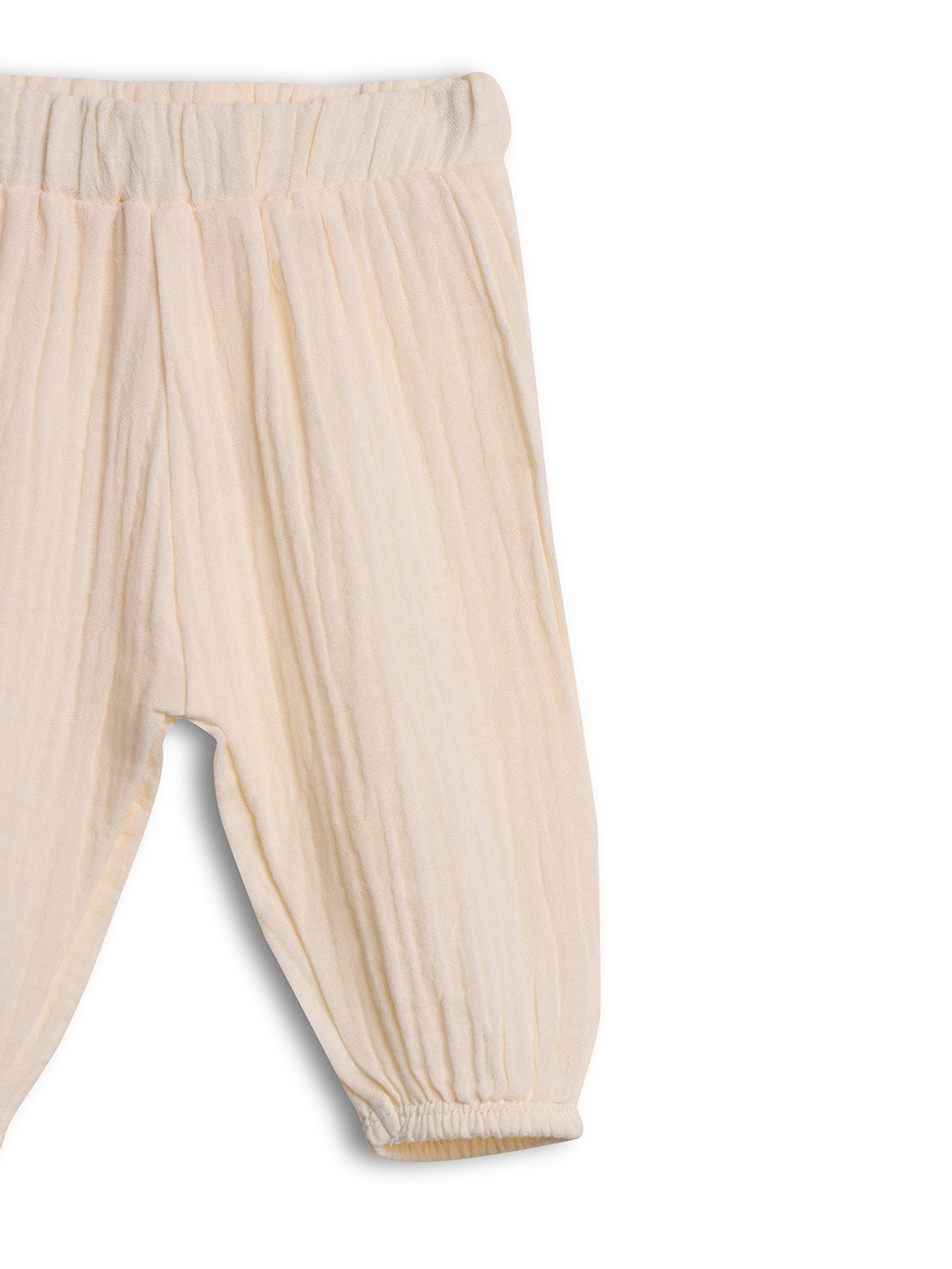 Beige baby pants on a white background