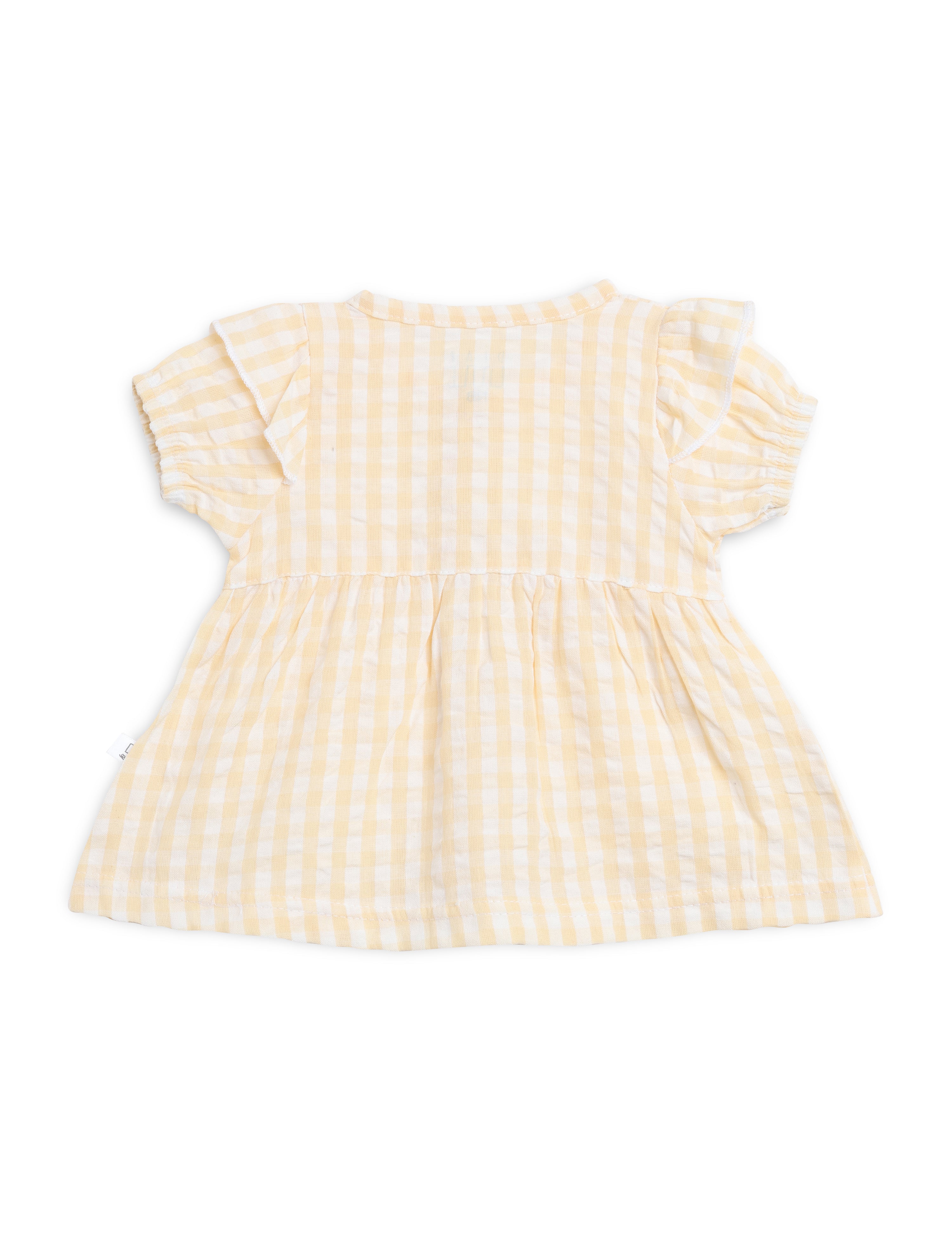 Yellow checkered dress on a white background