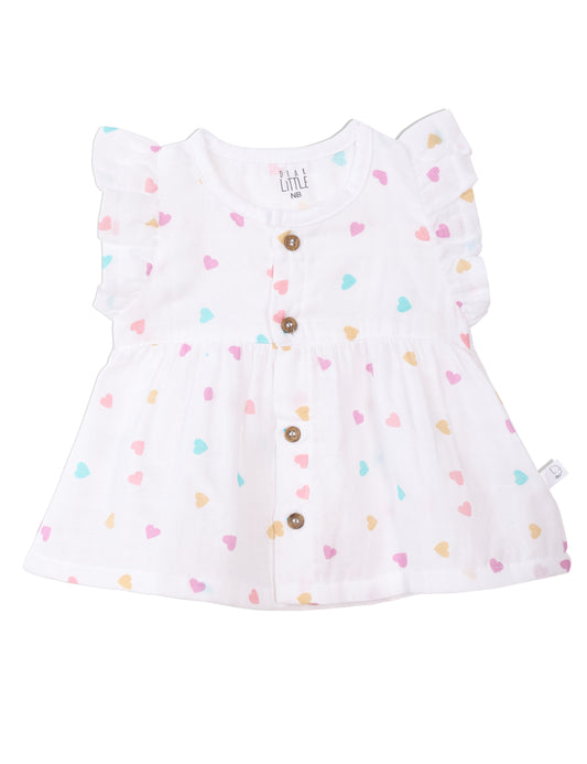 A white muslin frock with multicolor heart prints, ruffle sleeves, and wooden buttons designed for babies.