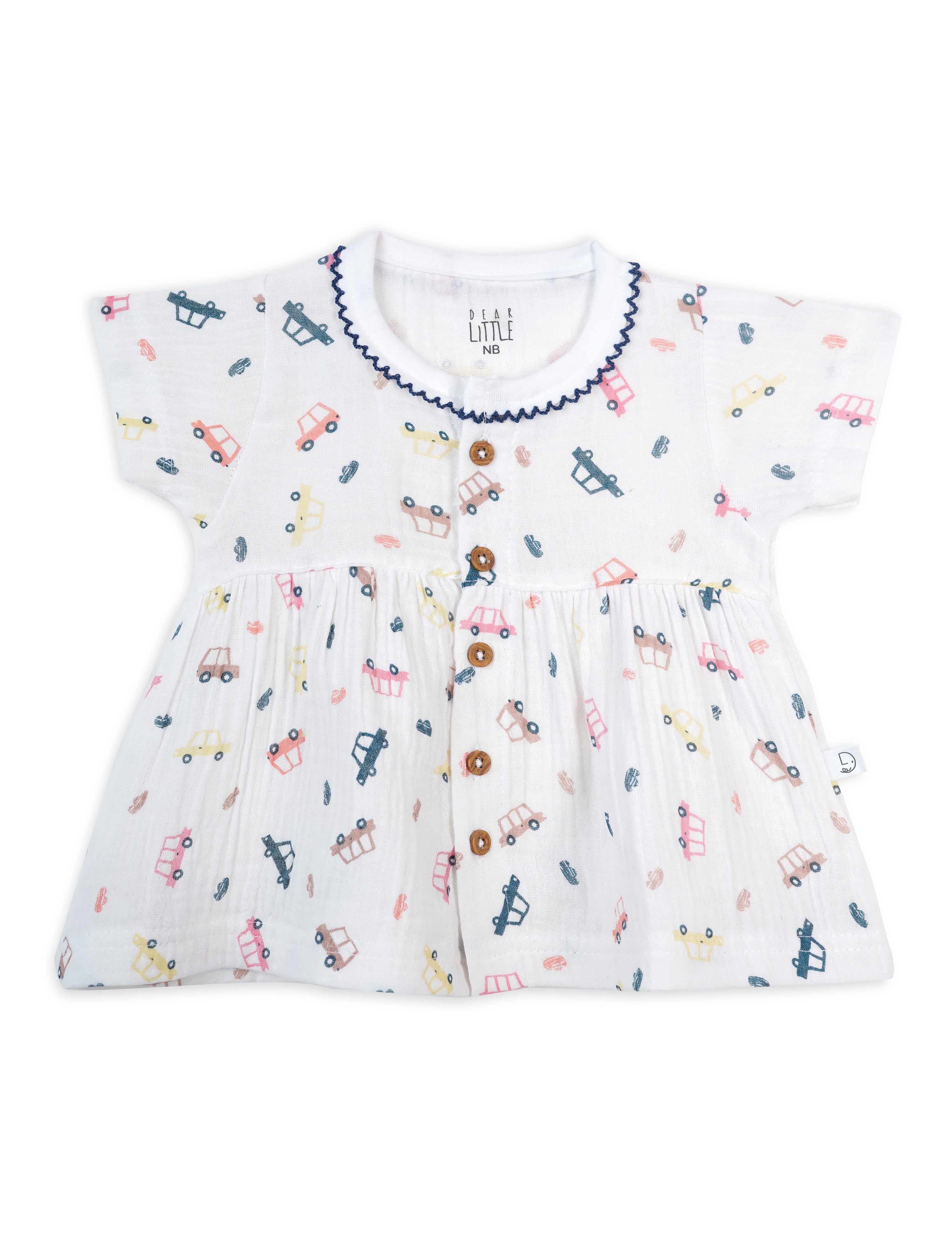 A short-sleeved baby frock in dark blue with a pattern of mini wheels.