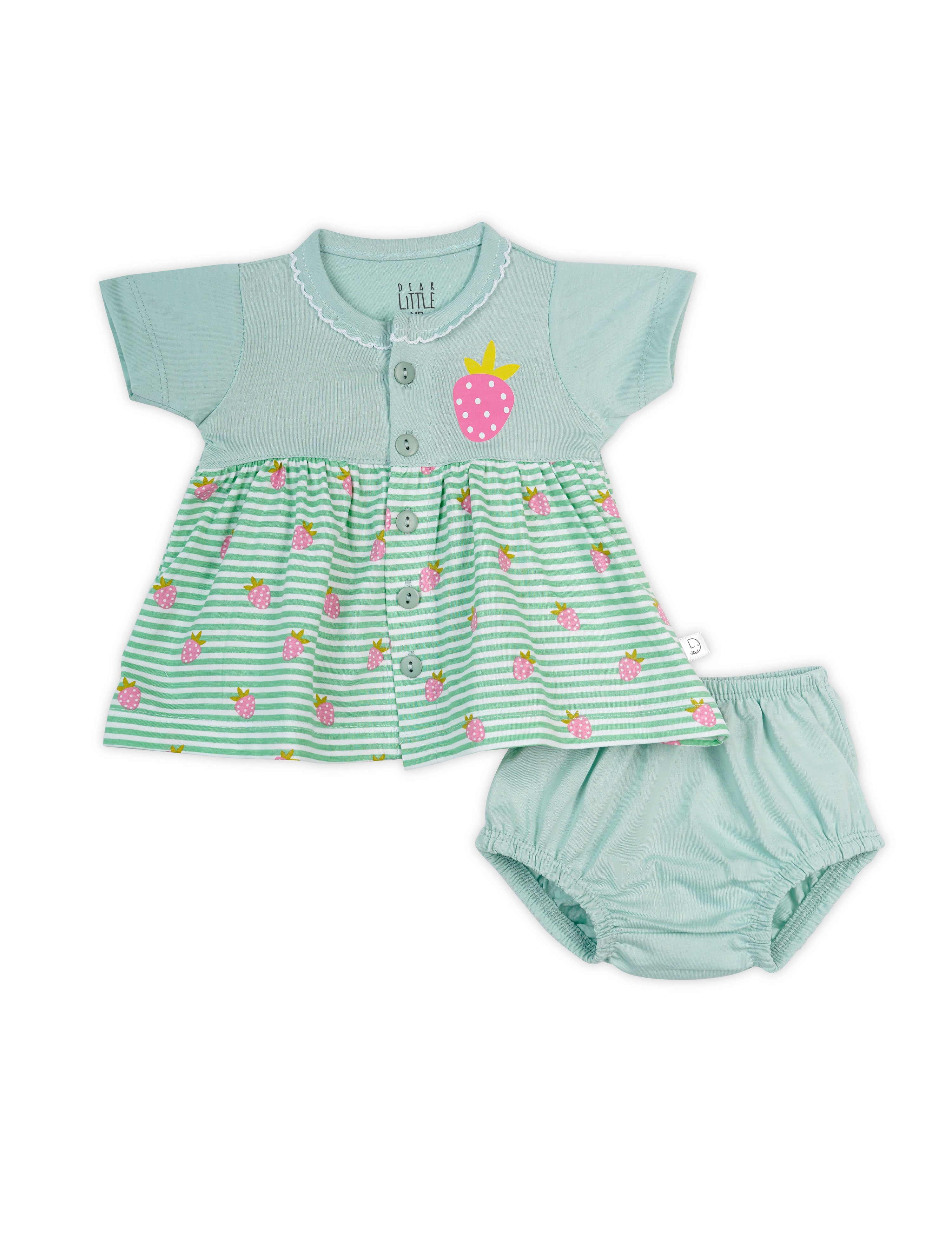 A green cotton baby frock with strawberry prints and a button-down front, accompanied by a matching diaper cover.